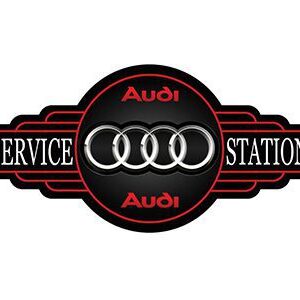 Vintage Audi service station logo with four rings and bold red text.
