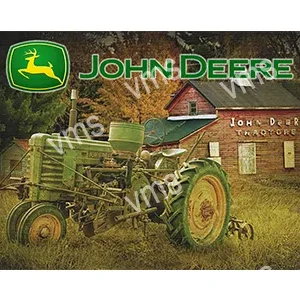 Vintage John Deere tractor in a rustic farm setting.