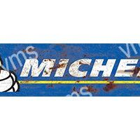 Vintage Michelin sign with the iconic Michelin Man on a blue background.