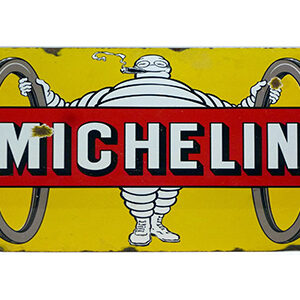 Vintage Michelin sign with yellow background and iconic Michelin Man.