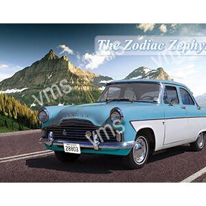 Classic blue and white vintage car on a scenic mountainous road.